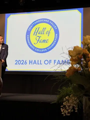Person presenting at the 2026 Hall of Fame event stage.